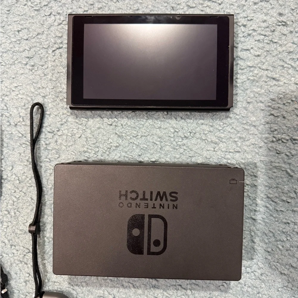 Nintendo Switch with Gray, Purple, and Orange Joy-Con Controllers